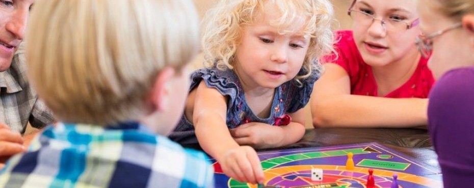 Family playing a board game together